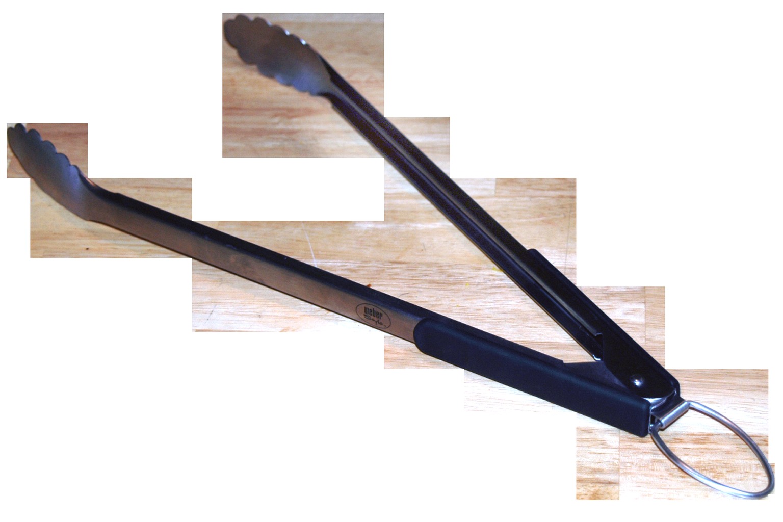 Long grilling tongs for handling food away from the cooking surface.