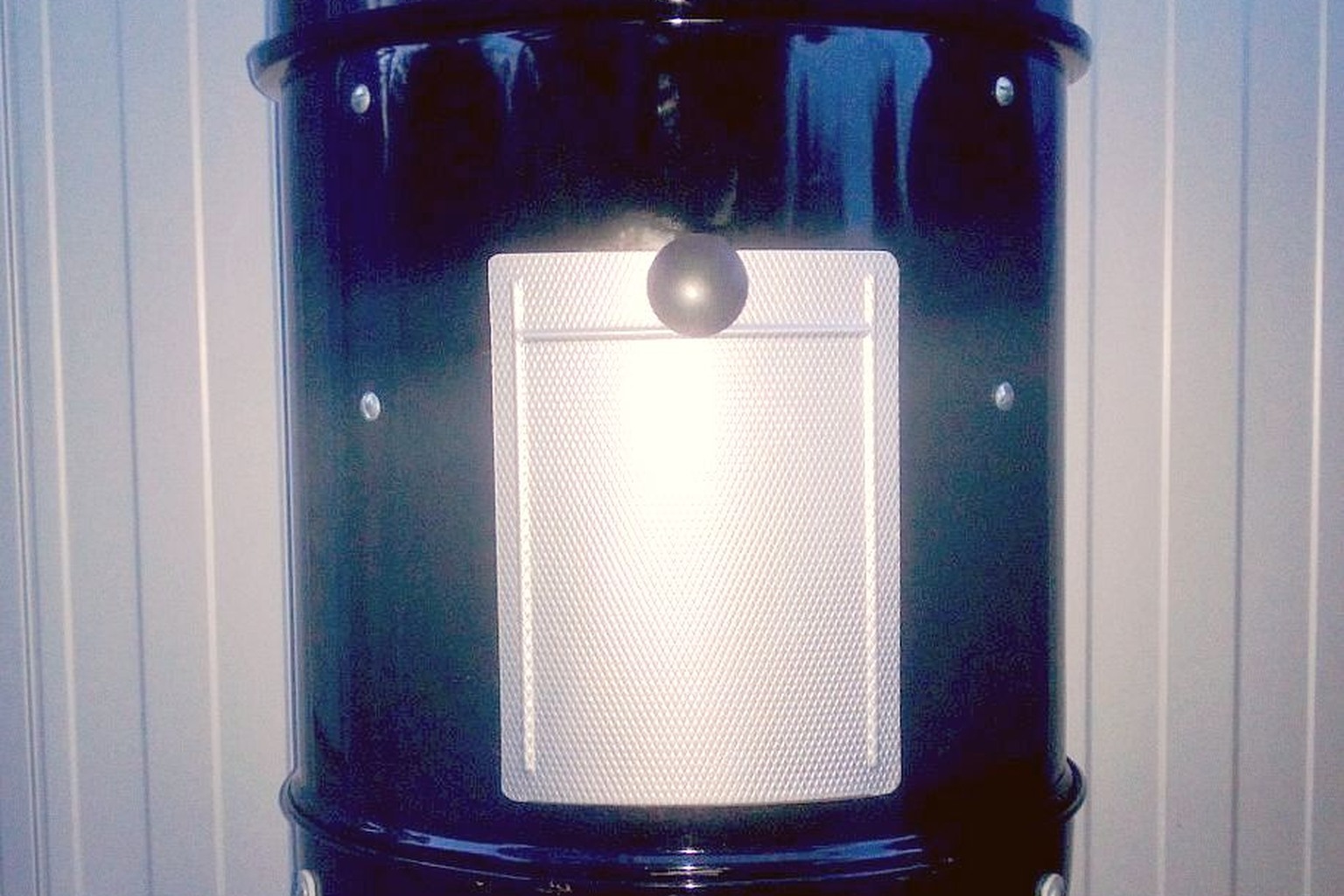 An open vertical Weber charcoal smoker. This photograph illustrates chamber shape, not a pellet-fueled model.